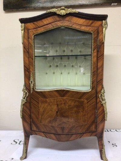 A French walnut petite cabinet with a lined interior and applied gilt metal mounts. Height 75cm width 45 cm