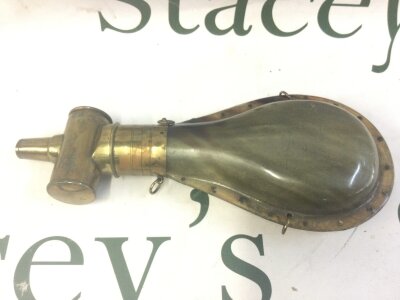 A horn and brass powder flask including measure