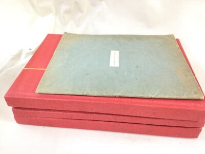 Three red albums containing Victorian and later stamps and a revenue stamp album