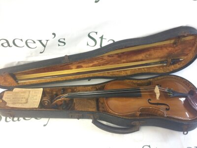 A cased students violin 60cm Long approx. No label