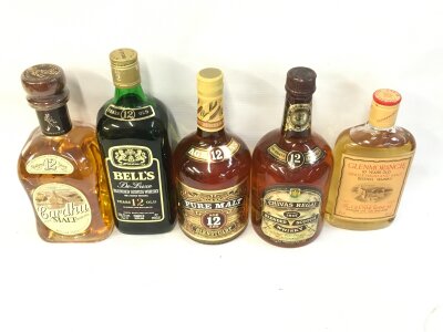 Five bottles of assorted whiskey including Glenmorangie , Chivas regal