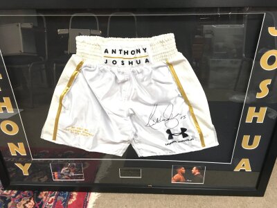 A Anthony Joshua Signed And Framed Boxing Shorts., With Certificate On Back. Approximate Size 120CM X 84CM.