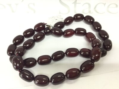 A Large not tested amber , cherry red style necklace, length 112cm (44”) weight 355 grams