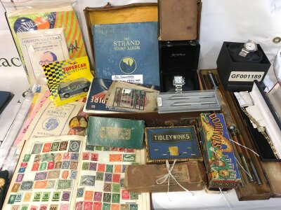 A collection of ephemera local vintage programs stamp albums, watches, pens etc
