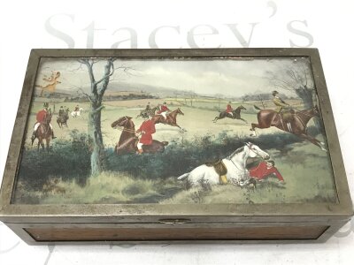 A Silver-plated cigar box featuring a hunting scene painting under glass on the lid. Dimensions 23.5cm wide, 7cm tall ,14cm deep NO RESERVE
