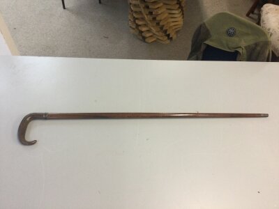 A sword stick with crook handle . 85cm long , sword 35cm long
