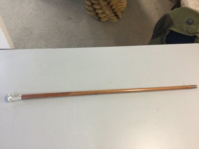 A sword stick with a Royal Fusiliers silver hallmarked top. Blade 39cm long. 90cm total length