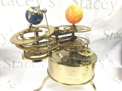 An Eaglemoss sun/moon/earth orbiter electric clock tellurium. 34cm tall