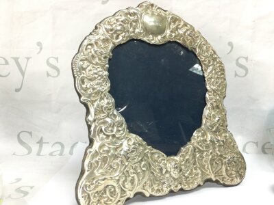 A hallmarked heart shaped silver photograph frame by Carr of Sheffield 1990s Height 28cm width 25cm
