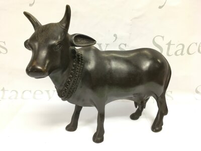 A 20th Century Indian model of a cow, approx height 29cm.