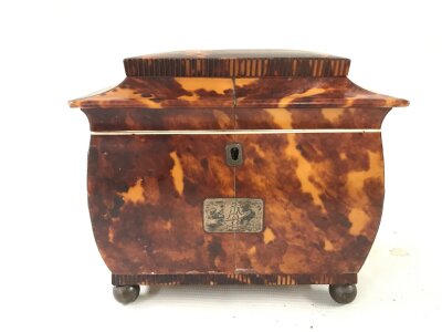 A tortoiseshell tea caddy 18cm wide 16cm tall 12cm long