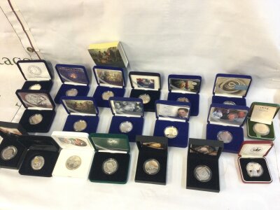 A large collection of silver and silver proof crowns and others.