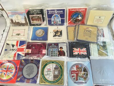 A large collection of uncirculated coin sets from 1982 to 2000 including multiple 1990 and 2000 sets.