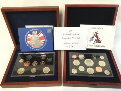 Two Royal Mint United Kingdom executives proof sets including 2004 and 2007.