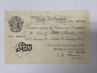 O’Brien, White £5 note, Y74 089508 Bank of England issue. Some handling marks, otherwise a pleasing note, the corners and margins still sharp.United Kingdom of Great Britain and Ireland Fisher second issue ten shillings banknote ‘F98 No.094799 also Guernsey Ten Shillings - 1966 16C 0101.