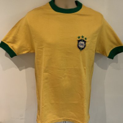 Gerson 1971 ( Match Worn )Brazil Shirt: Yellow number 8 short sleeve shirt. Made by Athleta. Label stitching on number and badge look original. COA from source in Brazil which states this came from the masseur. Photo identification of original seller from Brazil. We have asked an expert at gamewornfootballshirts and whilst the shirt is original and has all the credentials to be a shirt from that period they inform me even with this paperwork they do not ever accept coas from South America and the seller from Brazil has sold previously similar items for tens of thousands. For that reason this shirt is to be sold by us as a signed original shirt from the period only and not match worn.