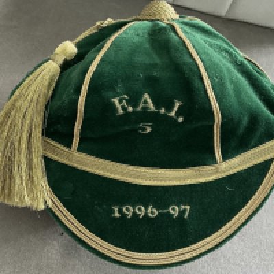 Republic Of Ireland 1996/97 Full International Football Cap: Fair condition green cap awarded to Blackburn Rovers player Jeff Kenna with FAI 5 and gold braid. Evidence of ex tape marks where previously on display.