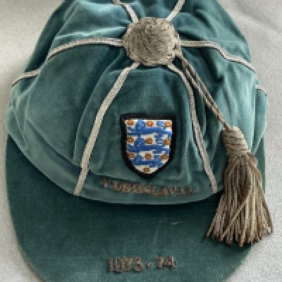 England 73/74 Full International Football Cap: Good condition blue cap awarded to Malcolm MacDonald for playing in the match v Yugoslavia on 5 6 1974. Football Wanted originally sold this cap and obtained it directly from Malcolm.
