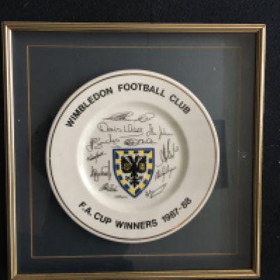 Wimbledon 1988 FA Cup Final Winners Framed Plate: Large fine bone china plate Ltd edition 1/300 with certificate to rear. Around edge it states Wimbledon Football Club FA Cup Winners 1987-88. Centre has the club badge and facsimile signatures of the team. Nicely framed.