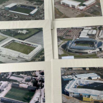 Football Grounds Mounted Aerial Photos: 16 x 12 colour photos for teams which would look great in a man cave or to have in a football quiz. When taken these would have been Englands top 4 divisions clubs. Includes Wigan Tranmere Stoke Sheffield United Scunthorpe Reading Elm Park + Madjeski Port Vale Oldham and Bolton. Top quality large photos. (10)