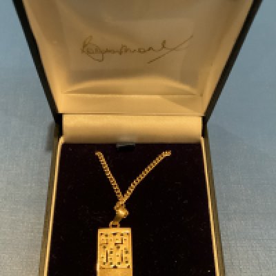1966 World Cup Bobby Moore Boxed Jewellery: Necklace with pendant which has a sparkly 66 above a faint autograph of Bobby Moore and is engraved. Original box has Bobby Moores autograph embossed in lining. Believed to be made by Windsor and Allen for the Bobby Moore Fund. Attractive gold coloured item.