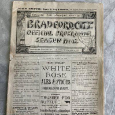 1911 - 1912 Bradford City v Bolton Football Programme: 1st Division match in fair condition with no team changes. Rusty staple making cover loose. Tear along spine inside and writing inside.