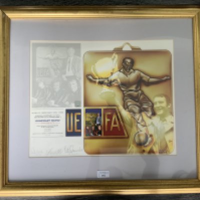 Manchester City 1970 ECWC Final Signed Football Print: Stunning limited edition print number 8/100 aptly named Goodnight Vienna with reference to Citys 1970 win in Austria over Gornik Zagreb. Print comes from reputable Becket Studio and is signed in pencil by Lee Summerbee and Bell. Tastefully framed in matching gold measuring 27 x 24 inches.