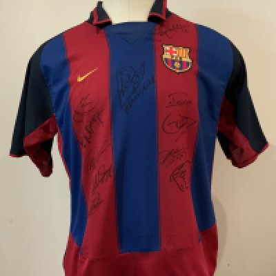 Barcelona Multi Signed Match Worn Football Shirt: Nike number 14 shirt signed by 12 worn by Gerard Lopez, in the Opening Match at the City of Manchester Stadium, 10th August 2003, between Manchester City and FC Barcelona. The shirt has been signed by twelve members of the Barcelona team, most notably Ronaldinho. The shirt was obtained by Clive Wilkes, Former Premier League Referee, who was Fourth Official in this fixture. Gerard Lopez made six appearances for the Spanish national team.