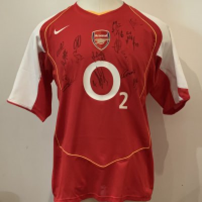 Arsenal 2004 - 2005 Squad Signed Football Shirt: Short sleeve Umbro shirt signed to front by 13 players. Good condition. Arsenal were FA Cup winners this season and Premiership runners up.