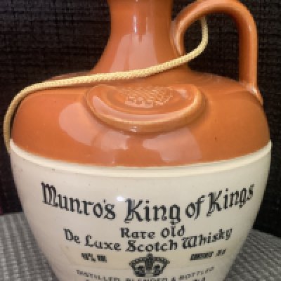 John Lyalls Bells Whisky Football Gifts: Munros King Of Kings Rare Old De Luxe Scotch Whisky (40 per cent) and a further labelled Bonnyrigg Wembley Club 1954-1979 (70 per cent with scuffing to label). Given to Lyall by his mentor Ron Greenwood but it is unknown how it was obtained and why it was passed on.
