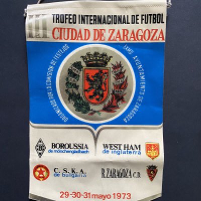 John Lyalls West Ham v Real Zaragoza Football Mementos: 1973 tour pennant given to Lyall which has the participating teams and date on it. Both these teams plus CSKA and Monchengladbach also mentioned. C/W a further pennant and badge thought to be picked up when the teams met in the ECWC semi final in 1965. (3)
