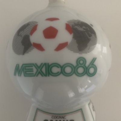 1986 Mexico World Cup Brandy Football Gift: Cognac Camus Napoleon Brandy believed to be brought back and gifted by Frank McAvennie. 700ml contents untouched.