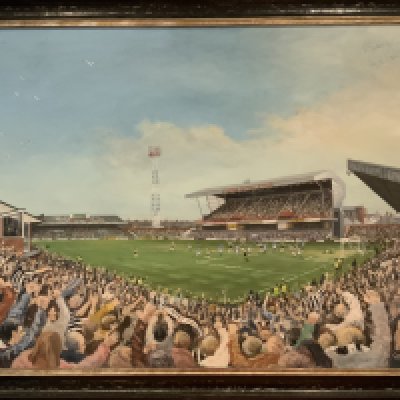 George Odin Grimsby Town Ground Original Painting: Framed oil painting of Blundell Park in 1991 which depicts Grimsby scoring v Exeter. Signed by Grimsby player John Cockerill. Measures 90 x 60cm and is not for posting.