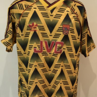 Arsenal Football Shirts Collection: Eight shirts in fair condition including an original 1991 bruised banana which has bobbing and a small tear to v neck. Three shirts with cracking to numbers. Various sizes. (8)