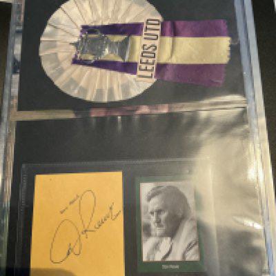 Leeds United Early 1970s Signed Football Photos: 12 x 8 inch photos hand signed by Sprake Harvey Bates Charlton Hunter Reaney Lorimer Giles Gray and Jones. Signed at organised event when the Revie statue got unveiled. C/W Bremner magazine picture and Revie yellow card and a Leeds FA Cup rosette. Neatly kept in collectors folder.