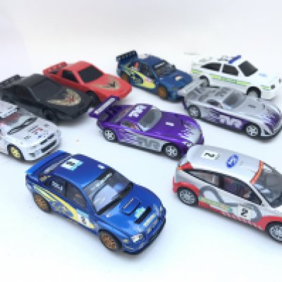 A Collection Of Scalextric Cars Including Subaru. Ford Focus. Etc.