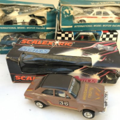 A Collection of Boxed Scalextric Cars. Boxes and Cars in Various States. No Reserve.