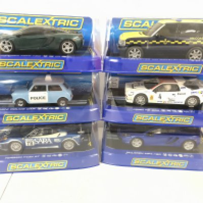 6 Boxed Scalextric Cars. 2 x McLaren MP4-12C. A Range Rover HM Coastguard. A Mini Police Car. A Ford RS 200. And a Ferrari F430 GT