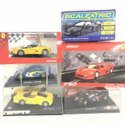 A Collection of 6 Boxed Slot Cars Including Scalextric. Ninco and Carrera.