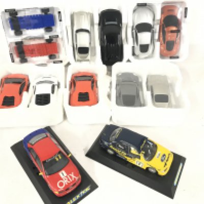 A Collection of Various Scalextric Cars. Including James Bond. A Audi A4. A Ford Mondeo. And Others.