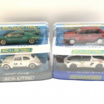 4 X Boxed Scalextric Cars including a Lamborghini Countach. A Volkswagen Golf MKI GTI. A Volkswagen Beatle and a Lorus Exige VS Cup R.
