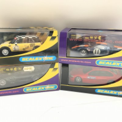 4 X Boxed Scalextric Cars. A Mini Cooper. A Mercedes-Benz SLR McLaren. A Ford GT40 and a Vauxhall Vectra.