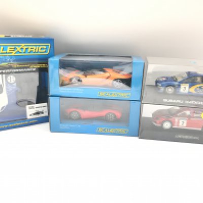 A Collection of 5 Boxed Scalextric Cars. A Subaru Impreza WRC. A Mitsubishi WRC. A Lamborghini. A Rasio c-20 and a Aston Martin DBR9 Assembly Kit.