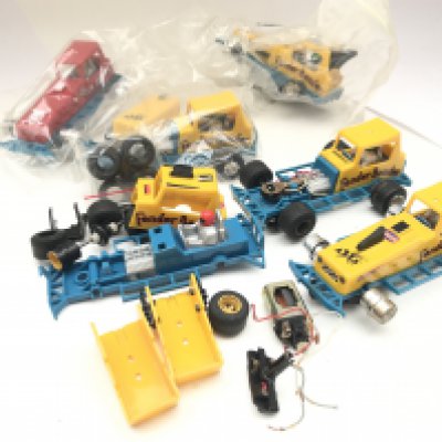 A Box Containing Scalextric Stock Cars Spare Parts Etc.