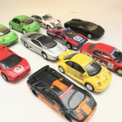 A Collection of 10 Scalextric Cars. Including VW Beatles. Ferrari etc.