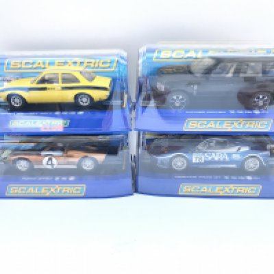 4 X Boxed Scalextric Cars a Ford Escort MK1. A Range Rover. A Ford GT40 and a Ferrari F430 GT.