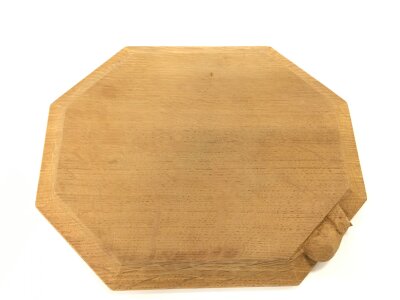 A Thomas mouseman cheeseboard. 31cm by 26cm.