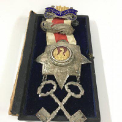 A Freemason medal from the grand Surrey lodge.; presented by the brothers of the grand Surrey lodge to Brode Williams for his services as treasurer, may 12th 1891.