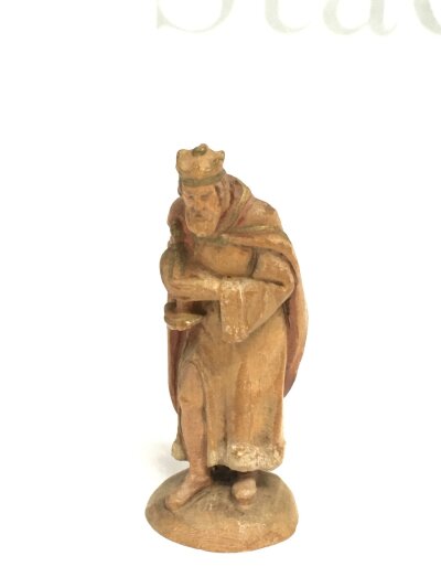 A small carved fruitwood figure, approx height 8cm.
