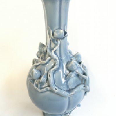 A Chinese porcelain blue powder with peach blossom relief vase , with a six character mark at base. 32cm tall approximately- NO RESERVE
